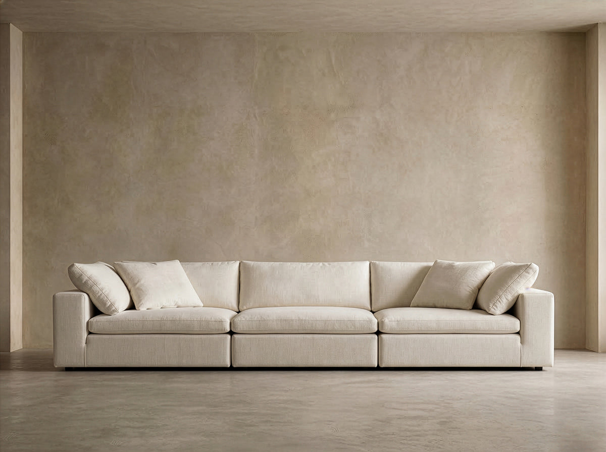 Cushing 3-seat modular sofa in Ivory Linen against a plaster wall, front view
